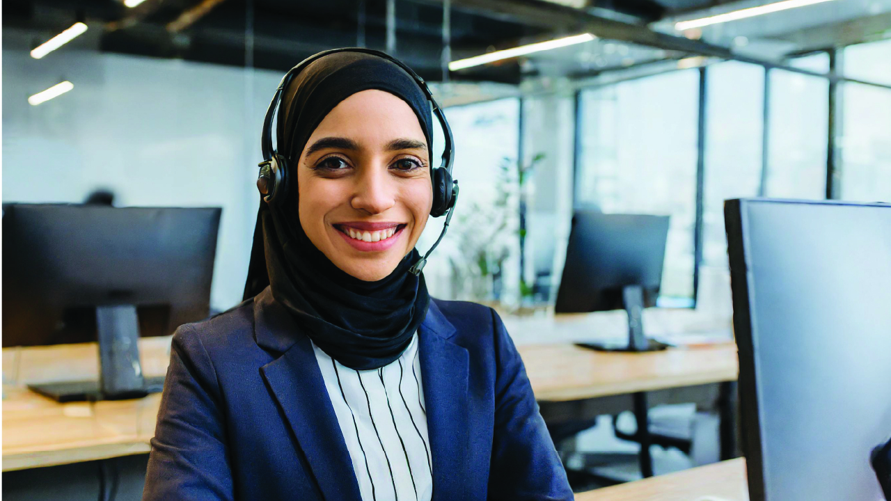 A Woman wearing hijab and headphone